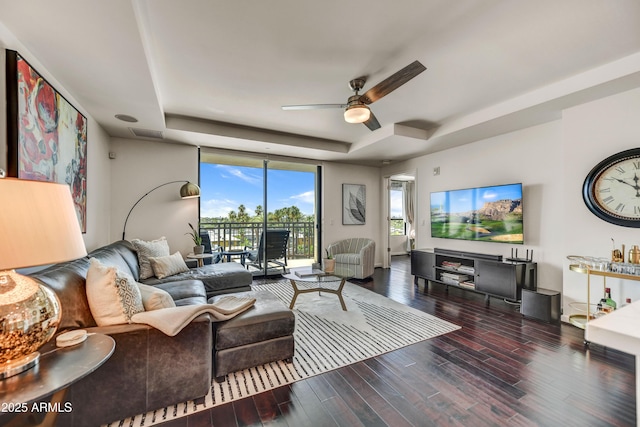 6803 E Main St Unit 5506, Scottsdale, AZ 85251 - living area featuring a tray ceiling, a ceiling fan, wood finished floors, and floor to ceiling windows