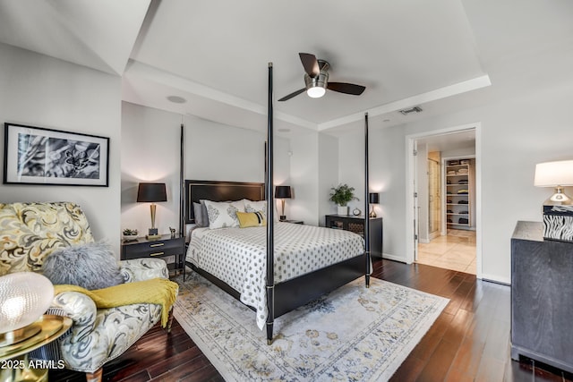 6803 E Main St Unit 5506, Scottsdale, AZ 85251 - bedroom with a tray ceiling, hardwood / wood-style floors, and ceiling fan