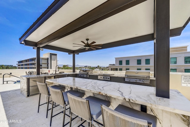 6803 E Main St Unit 5506, Scottsdale, AZ 85251 - view of patio / terrace featuring exterior kitchen and a ceiling fan