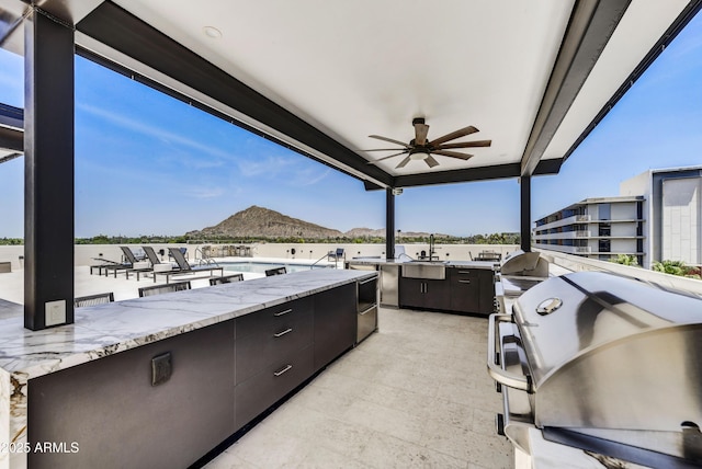 6803 E Main St Unit 5506, Scottsdale, AZ 85251 - view of patio / terrace featuring exterior kitchen, a ceiling fan, and a mountain view