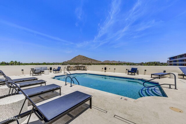 6803 E Main St Unit 5506, Scottsdale, AZ 85251 - community pool featuring a patio area and a mountain view