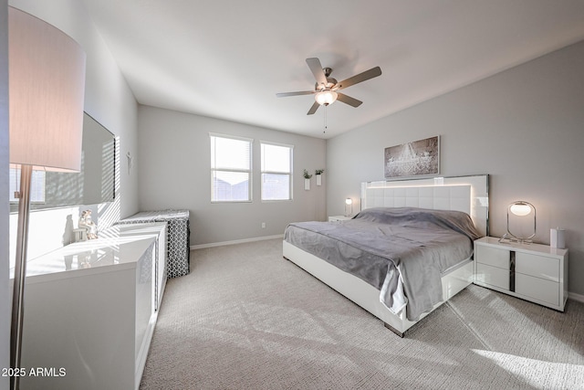 carpeted bedroom featuring ceiling fan and baseboards