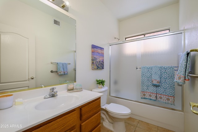 17640 W Babbitt Dr, Surprise, AZ 85374 - bathroom with tile patterned floors, enclosed tub / shower combo, toilet, vanity, and visible vents