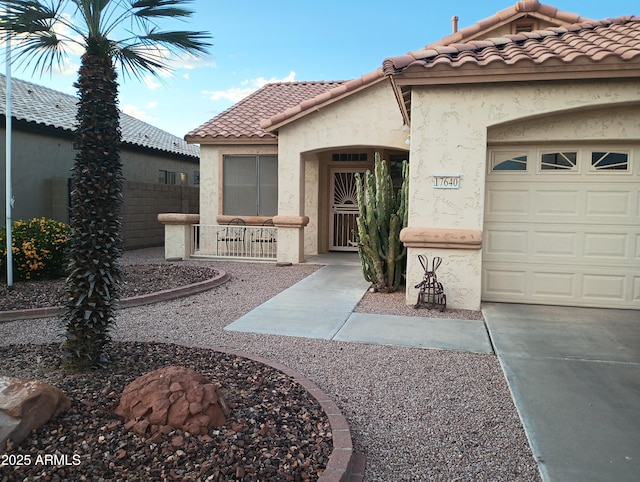 17640 W Babbitt Dr, Surprise, AZ 85374 - view of front facade with a garage, stucco siding, a tiled roof, and fence