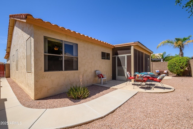 17640 W Babbitt Dr, Surprise, AZ 85374 - back of property featuring fence, stucco siding, a sunroom, and a patio area
