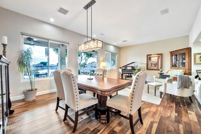 dining room with hardwood / wood-style flooring