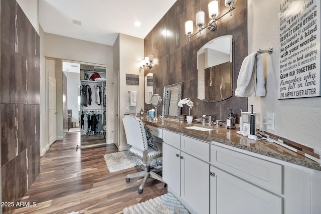 bathroom with vanity and wood-type flooring