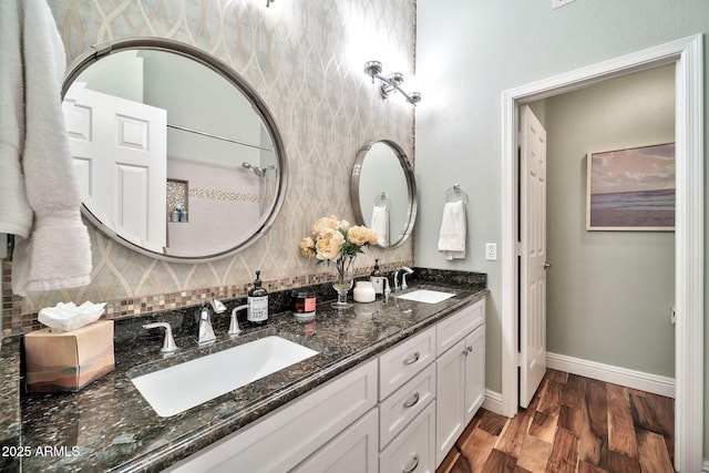 bathroom with hardwood / wood-style flooring, vanity, and backsplash