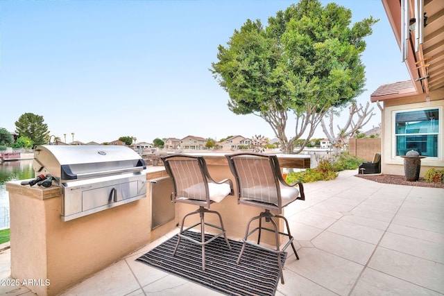 view of patio / terrace featuring a grill and exterior kitchen