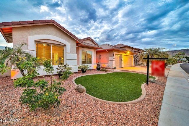 view of front facade featuring a garage and a front yard