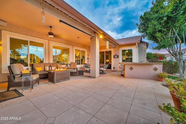 patio terrace at dusk with an outdoor hangout area