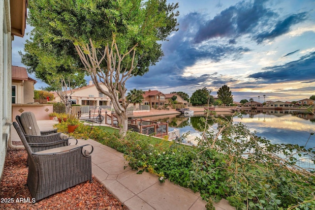 patio terrace at dusk with a water view