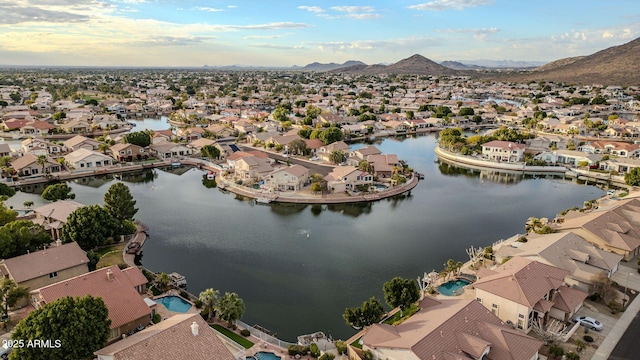 aerial view featuring a water and mountain view