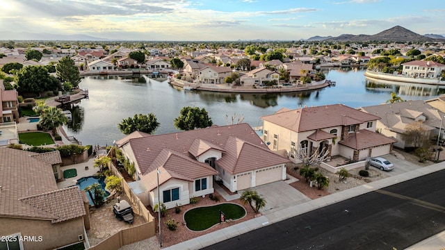 aerial view featuring a water and mountain view