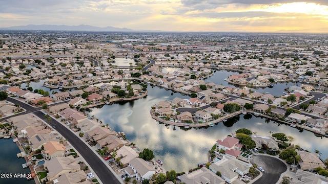 aerial view at dusk with a water view