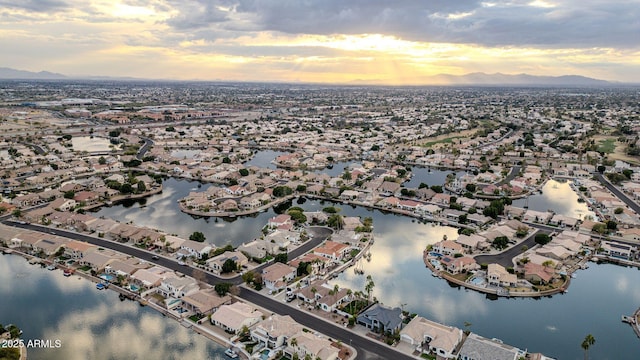 aerial view at dusk with a water view