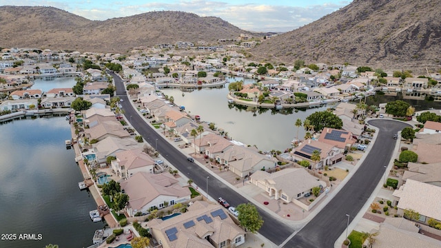 bird's eye view with a water and mountain view