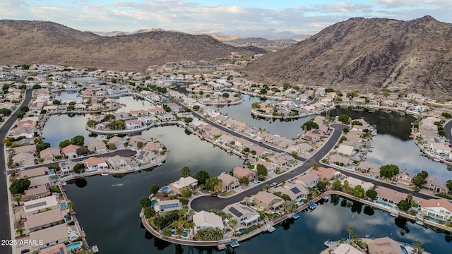 drone / aerial view with a water and mountain view