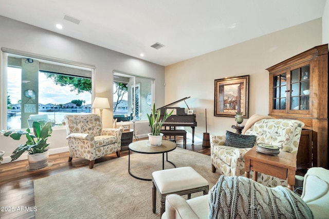 living area with hardwood / wood-style flooring