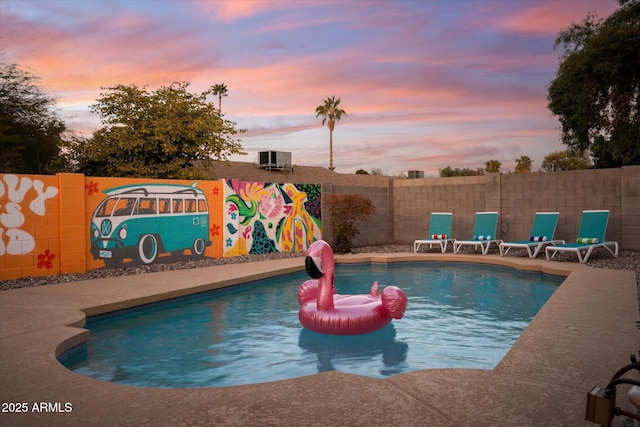 pool at dusk with central AC unit