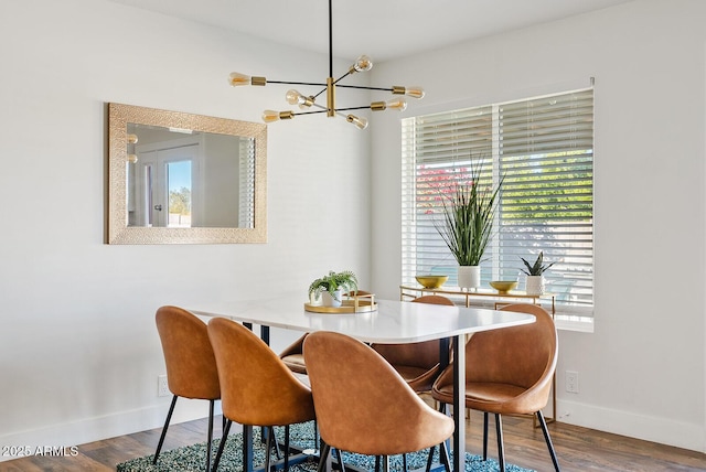 dining area featuring a chandelier and hardwood / wood-style floors