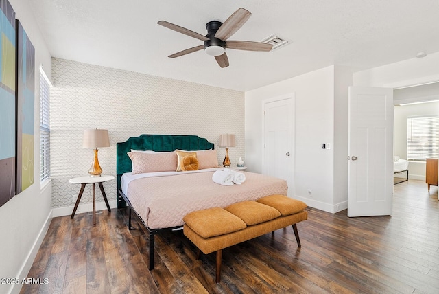 bedroom featuring dark wood-type flooring and ceiling fan