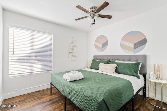 bedroom with dark wood-type flooring and ceiling fan