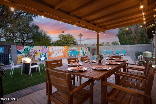 view of patio terrace at dusk