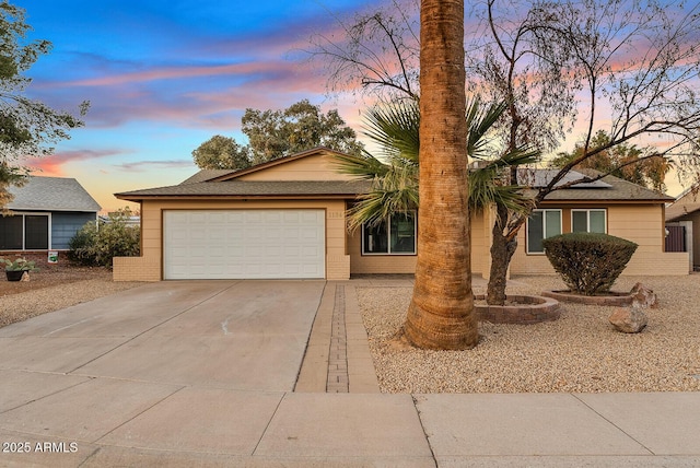 ranch-style house featuring a garage