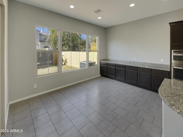 interior space featuring light tile patterned floors