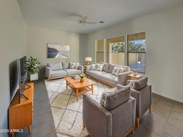 living room featuring tile patterned floors and ceiling fan