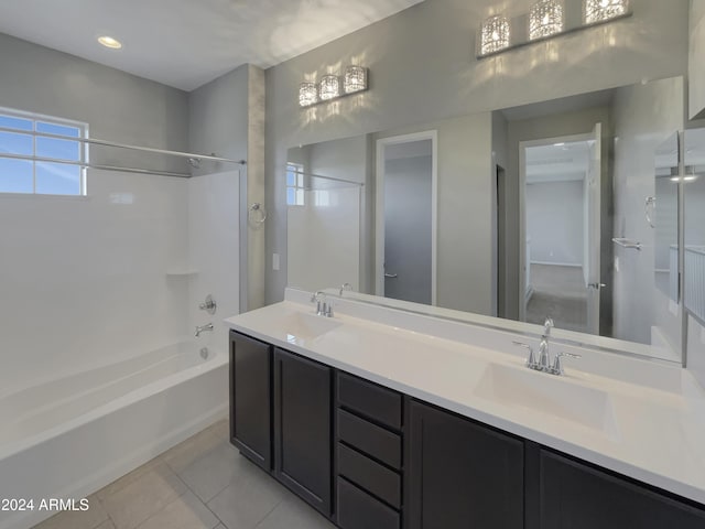 bathroom featuring tile patterned floors, vanity, and shower / bath combination