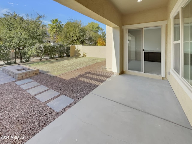 view of patio with an outdoor fire pit