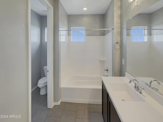 full bathroom featuring tile patterned flooring, vanity, toilet, and shower / tub combination