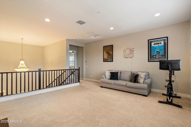 living room with light colored carpet, baseboards, visible vents, and recessed lighting