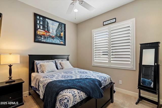 carpeted bedroom with baseboards and ceiling fan