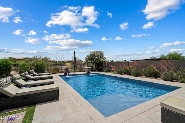 view of pool featuring a patio area, a fenced in pool, and a fenced backyard