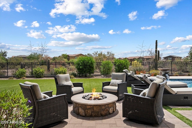 view of patio / terrace featuring a fenced backyard, an outdoor fire pit, and a fenced in pool