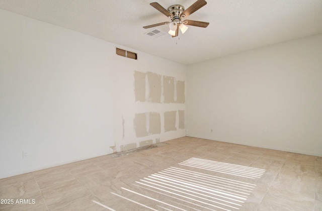 unfurnished room featuring ceiling fan