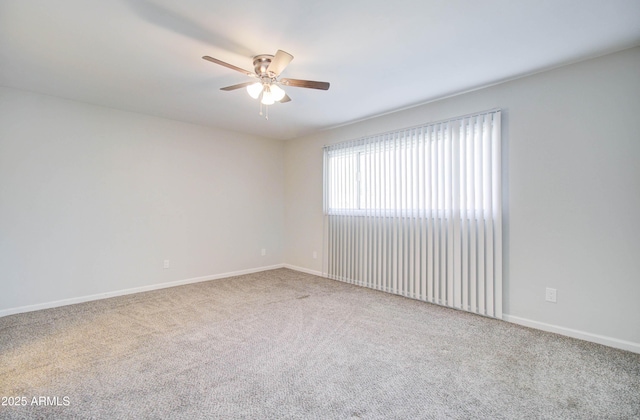 carpeted empty room featuring ceiling fan