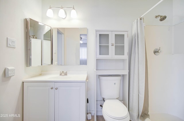 bathroom with toilet and vanity