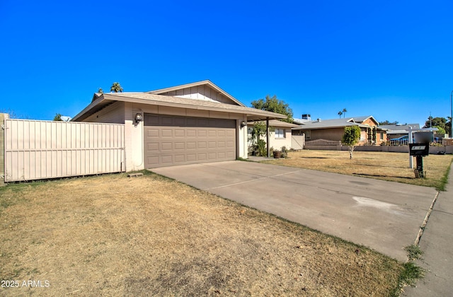 view of front of property featuring a front yard and a garage