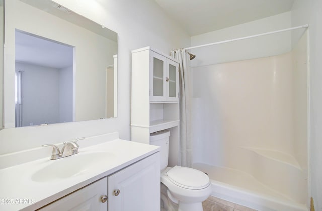 bathroom featuring toilet, vanity, and curtained shower