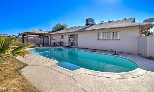 view of pool featuring a patio area, a gazebo, and central air condition unit