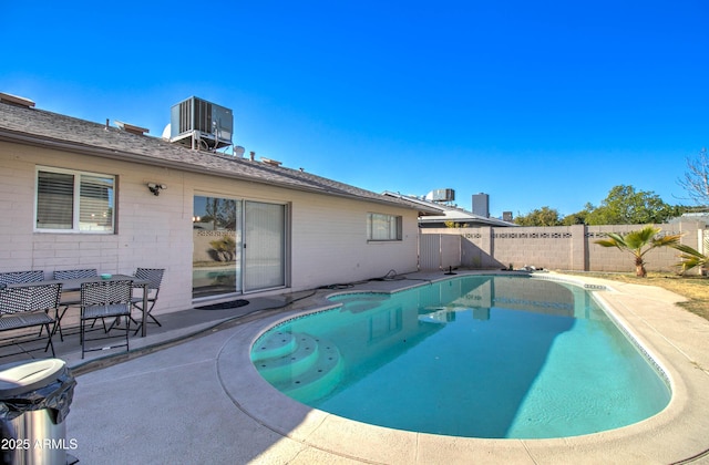 view of pool featuring a patio area and central AC unit