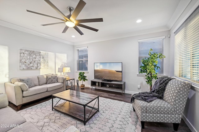 living room featuring light hardwood / wood-style flooring, ceiling fan, and ornamental molding