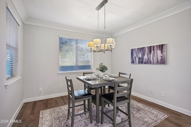 dining room featuring a chandelier, dark hardwood / wood-style flooring, and ornamental molding