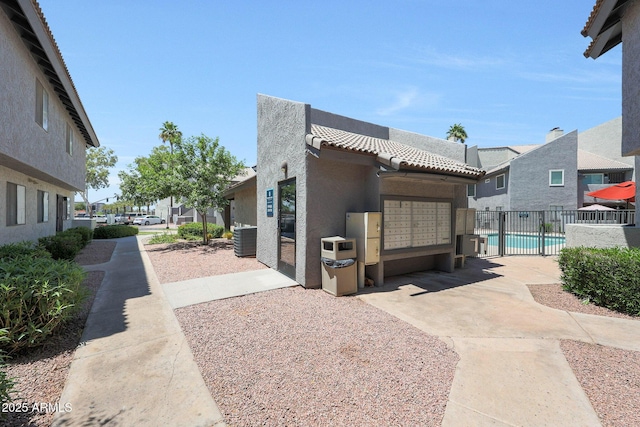 view of home's community with mail area, a garage, and a residential view