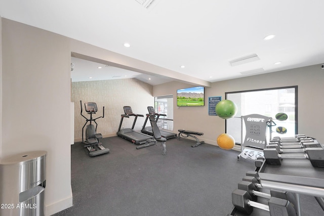 exercise room with baseboards, recessed lighting, and wallpapered walls