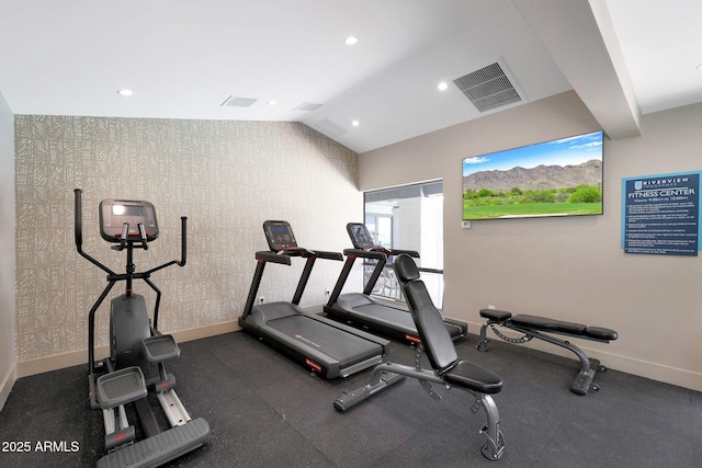 workout room featuring baseboards, vaulted ceiling, and recessed lighting